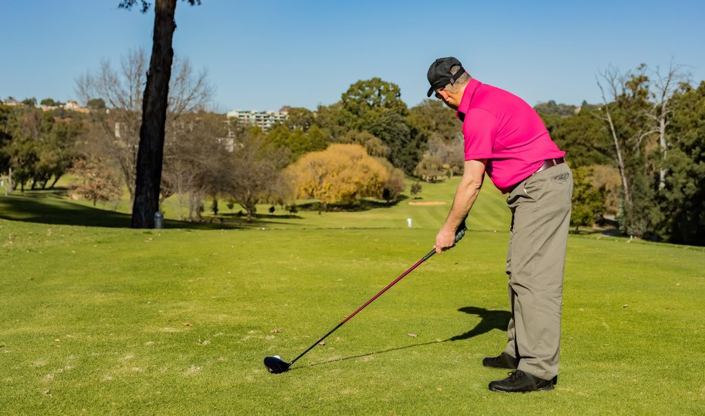professional-golf-player-playing-with-golf-club-grass-covered-course-1024x604 - Tour Quality Golf | Indoor Lessons, Fittings & Virtual Golf The Evolution of Club Fitting Over the Years